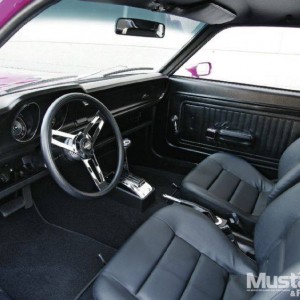 interior shot.. race seats and shifter on the floor, shoulder belts